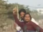 Video of the biker chasing a car and throwing stones went viral. Video of the biker chasing a car and throwing stones went viral.
