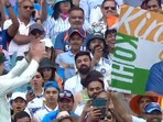 Sam Konstas shares a moment with the fans as one holds up a Virat Kohli flag.