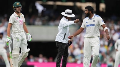 Umpire Sharfuddoula Saikat, centre, gestures to India's Jasprit Bumrah, right, as he exchanges words with Australia's Sam Konstas. (AP) Umpire Sharfuddoula Saikat, centre, gestures to India's Jasprit Bumrah, right, as he exchanges words with Australia's Sam Konstas. (AP)