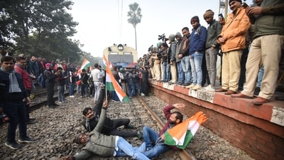 Agitators block a train in Patna demanding the cancellation of the 70th Integrated Combined Competitive (Preliminary) Examination (CCE), 2024, (Santosh Kumar)