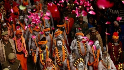 Sadhus walk in a religious procession of Atal Akhara, ahead of the Maha Kumbh Mela in Prayagraj. (AFP)