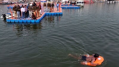 Police officials test a remote-controlled lifebuoy on the Ganges river, in preparation for the upcoming Maha Kumbh Mela. (AP)