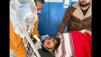 Jammu district president of the BJP Yuva Morcha Kanav Sharma being treated at a hospital after suffering a bullet injury on Friday. (PTI)