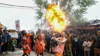 Artists perform during the 'Chavni Pravesh' by 'sadhus' of 'Shree Mahanirvani Akhada', the royal entry procession for Maha Kumbh Mela in Prayagraj. (PTI)
