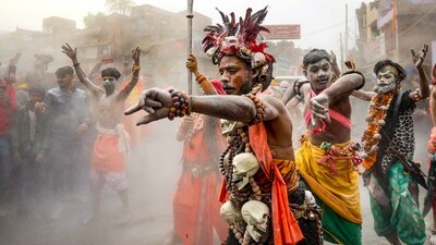 Artists perform during the 'Chavni Pravesh' by 'sadhus' of 'Shri Panchayati Akhada Mahanirvani', the royal entry procession for Maha Kumbh Mela. (PTI)