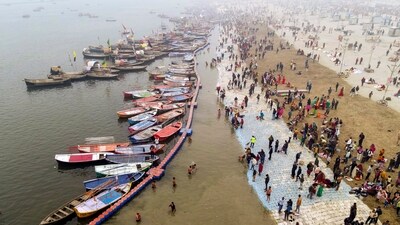 Devotees take a holy dip at Sangam ahead of Maha Kumbh Mela 2025, in Prayagraj. (PTI)