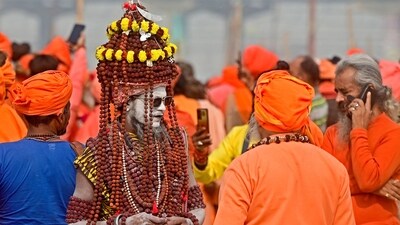 Sadhus arrive to raise Dharam Dhwaja (religious flag) ahead of the Maha Kumbh Mela festival in Prayagraj. (AFP)