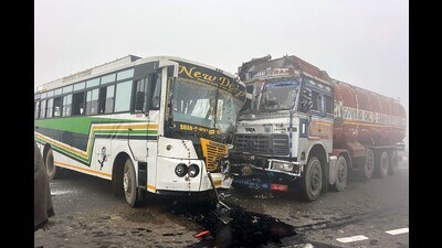The truck and the bus after the collision on Bathinda-Dabwali highway on Friday. (HT Photo)