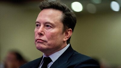 Tesla CEO and X owner Elon Musk listens as US President-elect Donald Trump speaks during a meeting with House Republicans at the Hyatt Regency hotel in Washington, DC, U.S. on November 13, 2024 (Allison Robbert/Pool via Reuters)