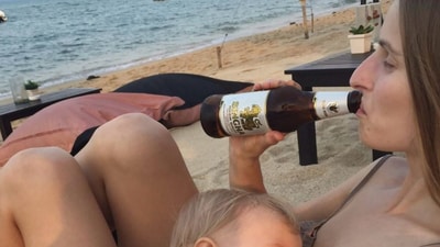 Olga Vlachynská shared a LinkedIn picture which shows her breastfeeding while drinking a beer Olga Vlachynská shared a LinkedIn picture which shows her breastfeeding while drinking a beer