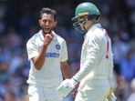 India's Prasidh Krishna celebrates the wicket of Australia's Alex Carey.
