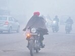Commuters wade through dense fog in Amritsar on Saturday. (HT Photo) Commuters wade through dense fog in Amritsar on Saturday. (HT Photo)