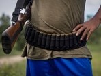 An armed Kuki man stands at a checkpoint at Kangvai village in Churachandpur district in Manipur. 