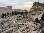 People and first responders inspect the rubble of a collapsed residential building that was hit by Israeli bombardment in the Saraya area in al-Rimal in central Gaza City on January 4, 2025 amid the ongoing war in the Palestinian territory between Israel and Hamas. People and first responders inspect the rubble of a collapsed residential building that was hit by Israeli bombardment in the Saraya area in al-Rimal in central Gaza City on January 4, 2025 amid the ongoing war in the Palestinian territory between Israel and Hamas.