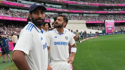 India's Jasprit Bumrah, left, and teammate Virat Kohli (AP) India's Jasprit Bumrah, left, and teammate Virat Kohli (AP)