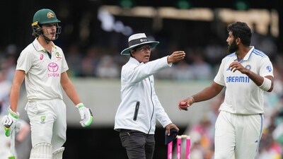 Umpire Sharfuddoula Saikat, centre, gestures to India's Jasprit Bumrah, right, as he exchanges words with Australia's Sam Konstas, left, during play on the first day of the fifth cricket test between India and Australia at the Sydney Cricket Ground, in Sydney, Australia, Friday, Jan. 3, 2025. (AP Photo/Mark Baker) (AP) Umpire Sharfuddoula Saikat, centre, gestures to India's Jasprit Bumrah, right, as he exchanges words with Australia's Sam Konstas, left, during play on the first day of the fifth cricket test between India and Australia at the Sydney Cricket Ground, in Sydney, Australia, Friday, Jan. 3, 2025. (AP Photo/Mark Baker) (AP)