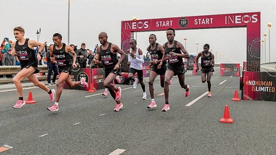 Kipchoge (in white) runs in his Nike Vaporfly shoes, shielded from wind resistance by other runners. (Photo via Ineos) Kipchoge (in white) runs in his Nike Vaporfly shoes, shielded from wind resistance by other runners. (Photo via Ineos)