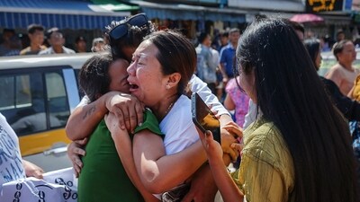Relatives celebrate with a released prisoner outside Insein prison on Myanmar's Independence Day (AFP) Relatives celebrate with a released prisoner outside Insein prison on Myanmar's Independence Day (AFP)