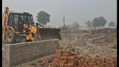 The operation, which went on for three hours on Saturday, was carried out under the supervision of senior officials of GNIDA, supported by security personnel, using three JCB machines and two dump-trucks. (HT PHOTO) The operation, which went on for three hours on Saturday, was carried out under the supervision of senior officials of GNIDA, supported by security personnel, using three JCB machines and two dump-trucks. (HT PHOTO)