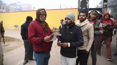 Bihar Public Service Commission (BPSC) 70th Prelims Re-Exam today. Candidates waiting outside exam centre at Mahath Hanuman Sharn high School, in Patna. (Santosh Kumar ) Bihar Public Service Commission (BPSC) 70th Prelims Re-Exam today. Candidates waiting outside exam centre at Mahath Hanuman Sharn high School, in Patna. (Santosh Kumar )