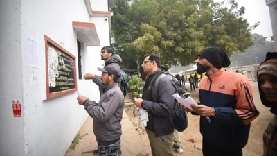 Applicants waiting in a queue outside examination center before entering an examination center to appear for the Bihar Public Service Commission (BPSC) 70th Prelims Exam, at B.N Collegiate Secondary High School, in Patna. (Santosh Kumar ) Applicants waiting in a queue outside examination center before entering an examination center to appear for the Bihar Public Service Commission (BPSC) 70th Prelims Exam, at B.N Collegiate Secondary High School, in Patna. (Santosh Kumar )