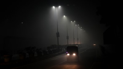 Dense fog reduced visibility in parts of Delhi to zero for an unprecedented nine-hour stretch, ending Saturday morning, the longest spell of the season, according to the weather department. (Hindustan Times)