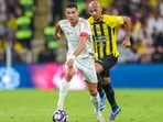 Cristiano Ronaldo runs with the ball during a Saudi Pro League football match. Cristiano Ronaldo runs with the ball during a Saudi Pro League football match.
