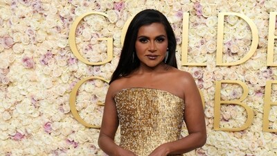 Mindy Kaling arrives at the 82nd Golden Globes on Sunday in golden number. (Jordan Strauss/Invision/AP)
