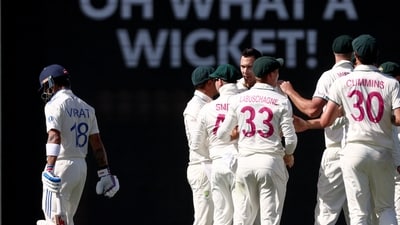 India's Virat Kohli (L) walks off the ground after being bowled by Australia's Scott Boland (C) (AFP) India's Virat Kohli (L) walks off the ground after being bowled by Australia's Scott Boland (C) (AFP)