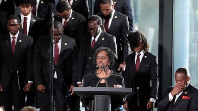 The service began with Bernstine Hollis praying during a service for the late former president Jimmy Carter. She was a longtime friend of the former president and an employee of the Carter Centre (Alex Brandon via REUTERS)