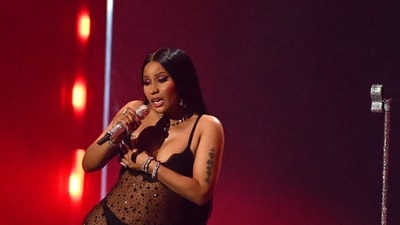 Nicki Minaj performs onstage during the MTV Video Music Awards in a black see-through embellished dress worn over matching black lingerie. (AFP) Nicki Minaj performs onstage during the MTV Video Music Awards in a black see-through embellished dress worn over matching black lingerie. (AFP)
