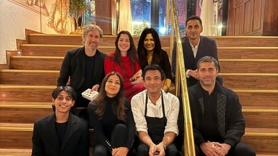 Vikas Khanna posed for a photo with Anne Hathaway outside his restaurant. Vikas Khanna posed for a photo with Anne Hathaway outside his restaurant.