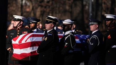 A military body bearer team carried former president's casket into the Jimmy Carter Presidential Library and Museum to lie in repose in Atlanta (AP) A military body bearer team carried former president's casket into the Jimmy Carter Presidential Library and Museum to lie in repose in Atlanta (AP)