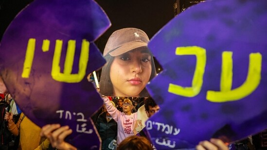 Family members of Liri Albag, an Israeli hostage taken captive by Palestinian militants to the Gaza Strip during the October 7 attacks, demonstrate in Tel Aviv on January 4, 2025, calling for action to secure the release of the Israeli hostages amid the ongoing war in the Palestilian territory between Israel and Hamas. (Photo by Jack GUEZ / AFP)