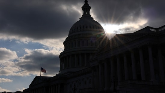 The national flag was flown at half-staff at the US Capitol building in Washington DC in honour of the former president Jimmy Carter's death&nbsp;(REUTERS/Fabrizio Bensch)