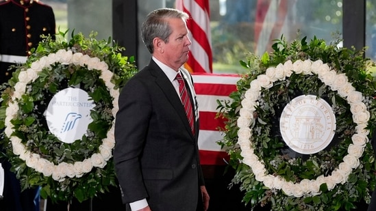 Georgia governor Brian Kemp was also present at the funeral to pay his last respects to the late Jimmy Carter(AFP)