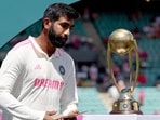 India's Jasprit Bumrah reacts as he walks past the trophy during an official ceremony after the fifth cricket Test match against Australia. India's Jasprit Bumrah reacts as he walks past the trophy during an official ceremony after the fifth cricket Test match against Australia.