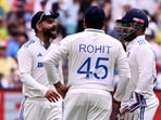India's Virat Kohli (L) speaks with teammates Rohit Sharma (C) and Rishabh Pant (R) on the first day of the fourth cricket Test match between Australia and India India's Virat Kohli (L) speaks with teammates Rohit Sharma (C) and Rishabh Pant (R) on the first day of the fourth cricket Test match between Australia and India