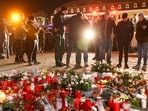 People lay flowers in the cathedral square of Magdeburg, Germany, in remembrance for the victims of the attack at a Christmas market on Dec. 20, 2024. 