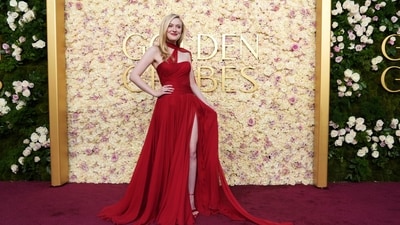 Dakota Fanning sizzles in red for the awards night. (Jordan Strauss/Invision/AP)