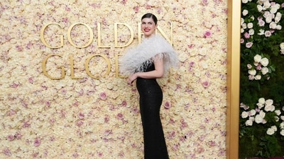 Alexandra Daddario arrives in a feathery outfit. The actor recently became a mother. (Jordan Strauss/Invision/AP)