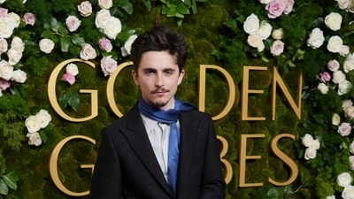 Timothee Chalamet arrives at the 82nd Golden Globes. (Jordan Strauss/Invision/AP)