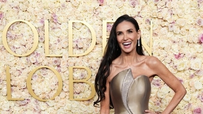 Demi Moore arrives at the 82nd Golden Globes. (Jordan Strauss/Invision/AP)