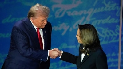FILE - Republican presidential nominee former President Donald Trump, left, and Democratic presidential nominee Vice President Kamala Harris shake hands before the start of an ABC News presidential debate, (AP)