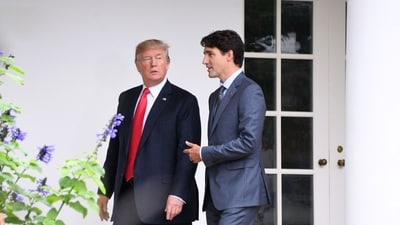 US President Donald Trump (L) listens to Canadian Prime Minister Justin Trudeau as they walk towards the Oval Office of the White House in Washington. (AFP / Jim Watson) US President Donald Trump (L) listens to Canadian Prime Minister Justin Trudeau as they walk towards the Oval Office of the White House in Washington. (AFP / Jim Watson)
