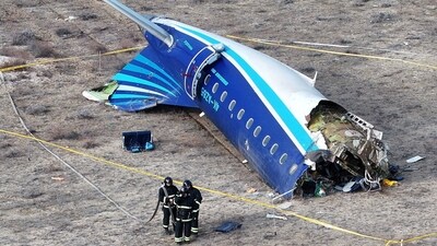 Emergency specialists working at the crash site of an Azerbaijan Airlines passenger plane (REUTERS/Azamat Sarsenbayev/File Photo)