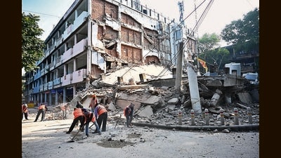 The iconic building gave way around 7 am. It had been sealed a week ago after structural issues had appeared during ongoing renovation work that was reportedly initiated without getting revised building plan cleared from the UT Estate Office. (Ravi Kumar/HT) The iconic building gave way around 7 am. It had been sealed a week ago after structural issues had appeared during ongoing renovation work that was reportedly initiated without getting revised building plan cleared from the UT Estate Office. (Ravi Kumar/HT)