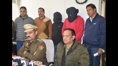 The two accused in police custody in Panchkula on Monday. (Sant Arora /HT) The two accused in police custody in Panchkula on Monday. (Sant Arora /HT)