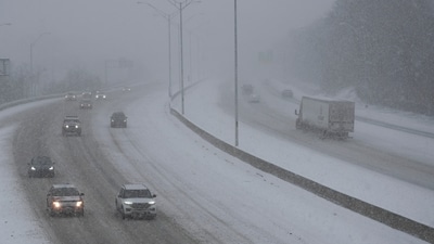 Vehicles drive along a snow-hit highway during a winter storm, Sunday, January. 5, 2025, in Cincinnati. Snow and ice blanketed major roadways in nearly all of Kansas, western Nebraska and parts of Indiana. (AP) Vehicles drive along a snow-hit highway during a winter storm, Sunday, January. 5, 2025, in Cincinnati. Snow and ice blanketed major roadways in nearly all of Kansas, western Nebraska and parts of Indiana. (AP)