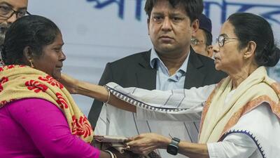 West Bengal chief minister Mamata Banerjee consoles a fisherman's wife whose husband had jumped in the water before arrest in Bangladesh and has been missing since then, during the felicitation of fishermen who were recently released from Bangladesh jail, at Sagar Island in South 24 Parganas district on Monday. (PTI) West Bengal chief minister Mamata Banerjee consoles a fisherman's wife whose husband had jumped in the water before arrest in Bangladesh and has been missing since then, during the felicitation of fishermen who were recently released from Bangladesh jail, at Sagar Island in South 24 Parganas district on Monday. (PTI)